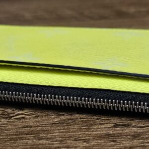 Side of the card holder showing the zipped compartment