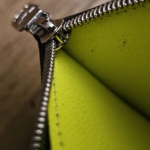 Zip pull and the interior of the compartment showing light marks