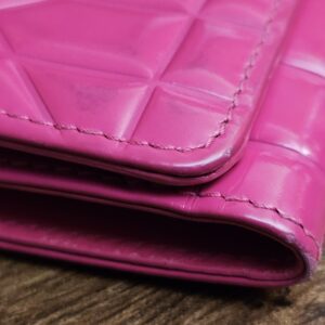 Flap edge of the Cannage wallet with surface marks
