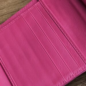 Row of card slots inside the hot pink wallet