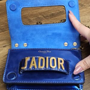 Flap open to show the blue suede interior