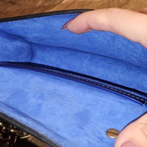 Interior slip pocket in the blue suede lining