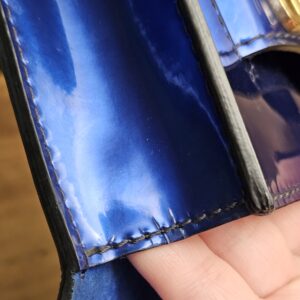Edge wear visible under the flap