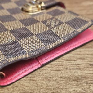 Corner of the agenda showing the red leather edge