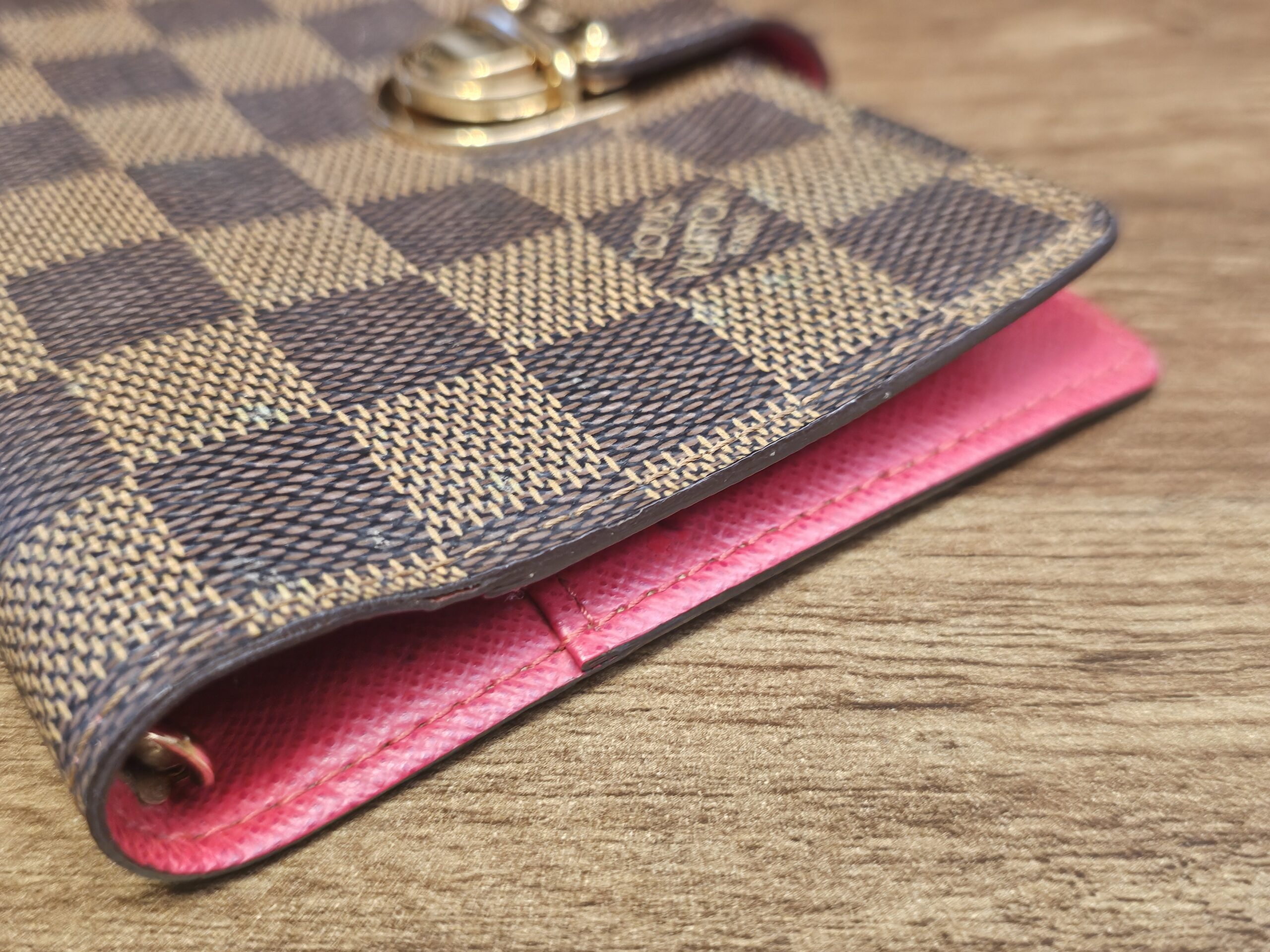 Corner of the agenda showing the red leather edge