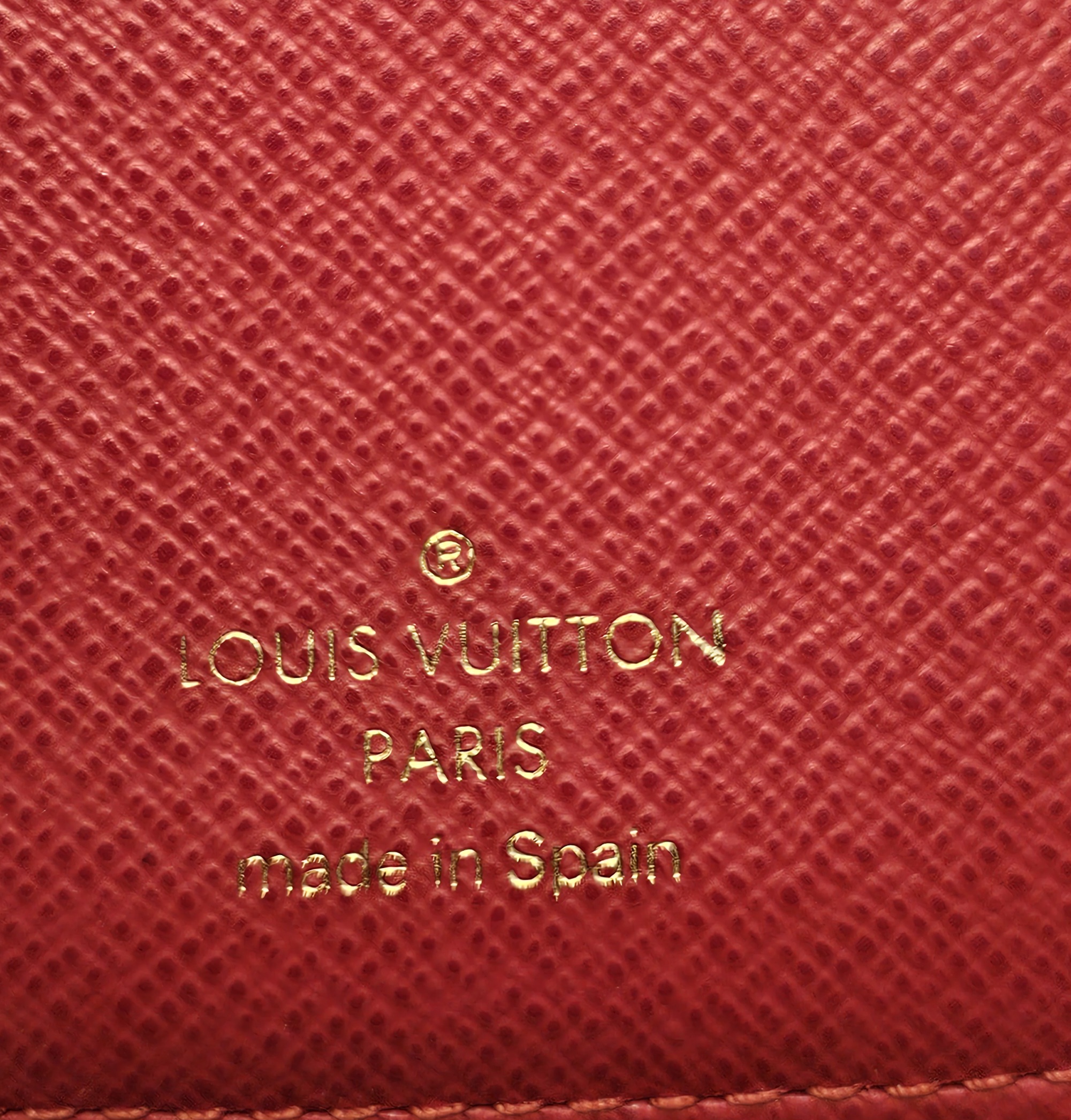 LOUIS VUITTON PARIS made in Spain stamp on the red interior