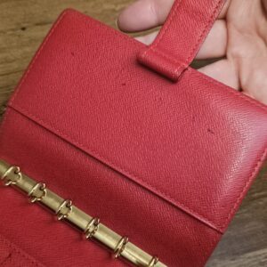 Red leather interior showing marks and signs of use