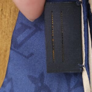 Care tag stitched to the scarf edge