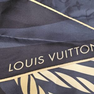 LOUIS VUITTON printed along the navy border
