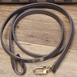 Full length of the brown leather strap with gold-tone snap hooks