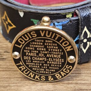 Gold-tone medallion buckle engraved LOUIS VUITTON TRUNKS AND BAGS with city names