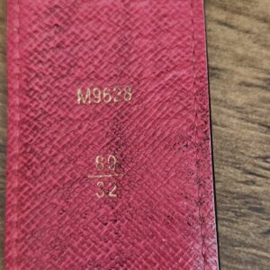 Pink leather underside stamped M9628 and size 80/32
