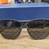 Louis Vuitton Z1333W Waimea Monogram Sunglasses Black - front view on the blue Louis Vuitton box