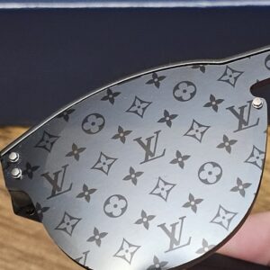 Close-up of the Monogram pattern on the dark lens