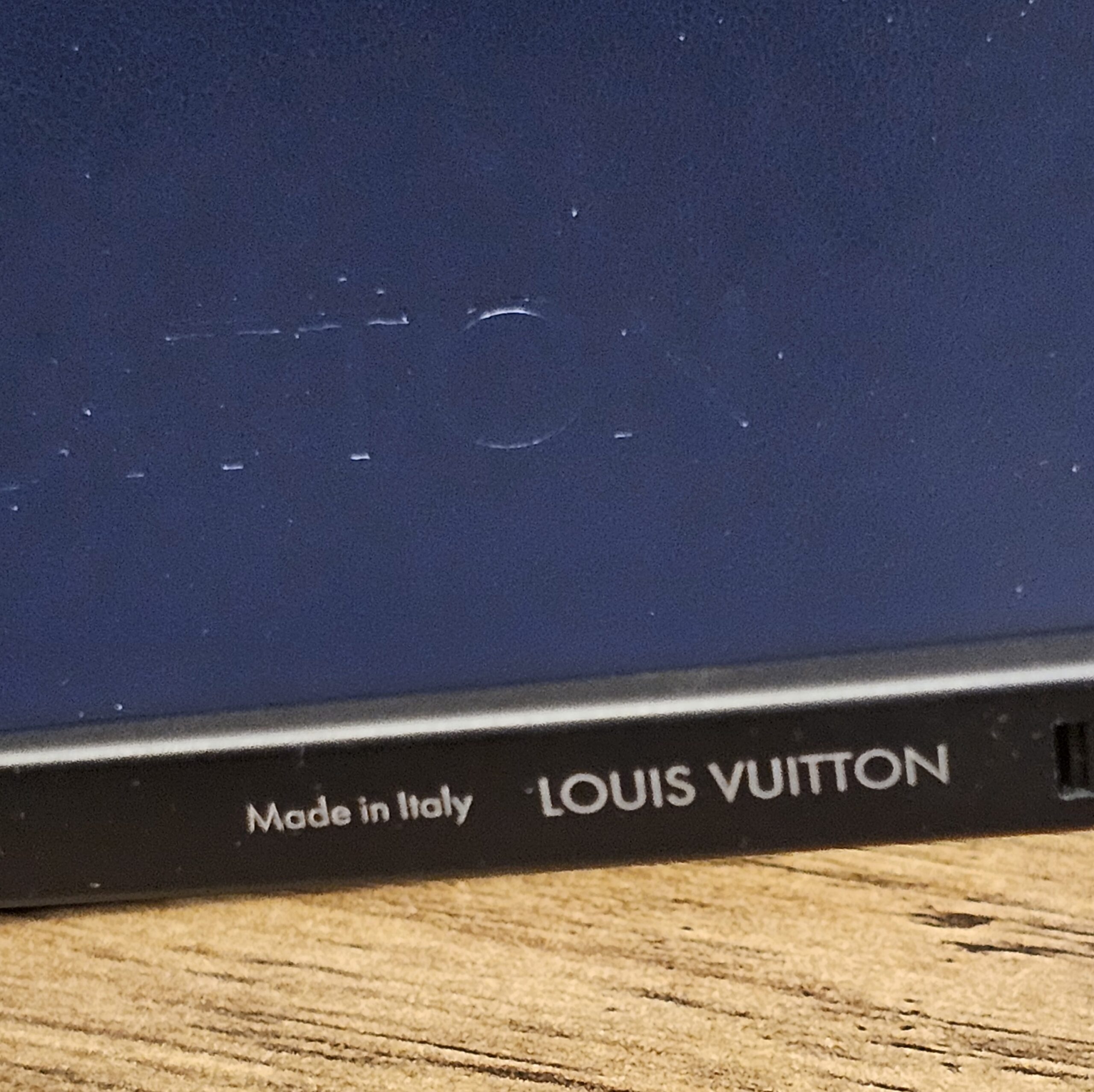 Made in Italy and LOUIS VUITTON printed inside the temple