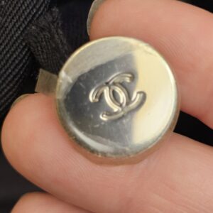 Close up of the CC snap button on the Deauville tote