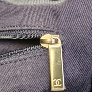 Interior zipped pocket with the CC engraved zip pull