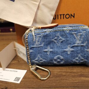Louis Vuitton Monogram Denim Speedy Trousse MM Blue shown with its box, dust bag and original tags