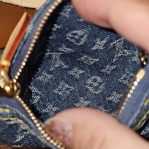 Open Speedy Trousse showing the denim lined interior