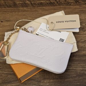 Louis Vuitton Monogram Empreinte Key Pouch Sweet Lavender shown with its box, dust bag and original tags