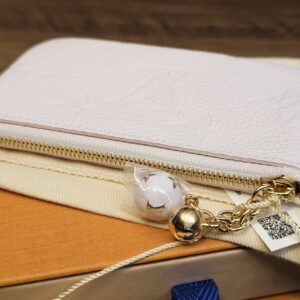 Sweet Lavender key pouch laid flat with the gold-tone zip and chain