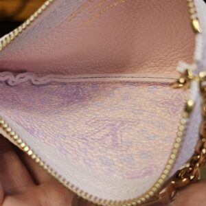Open key pouch showing the pink lavender leather interior