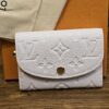Louis Vuitton Monogram Empreinte Rosalie Coin Purse Sweet Lavender shown front on with the embossed Monogram and snap closure