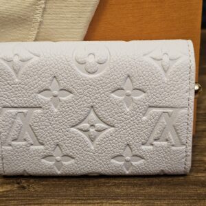 Back of the Sweet Lavender Empreinte Rosalie coin purse showing the embossed Monogram