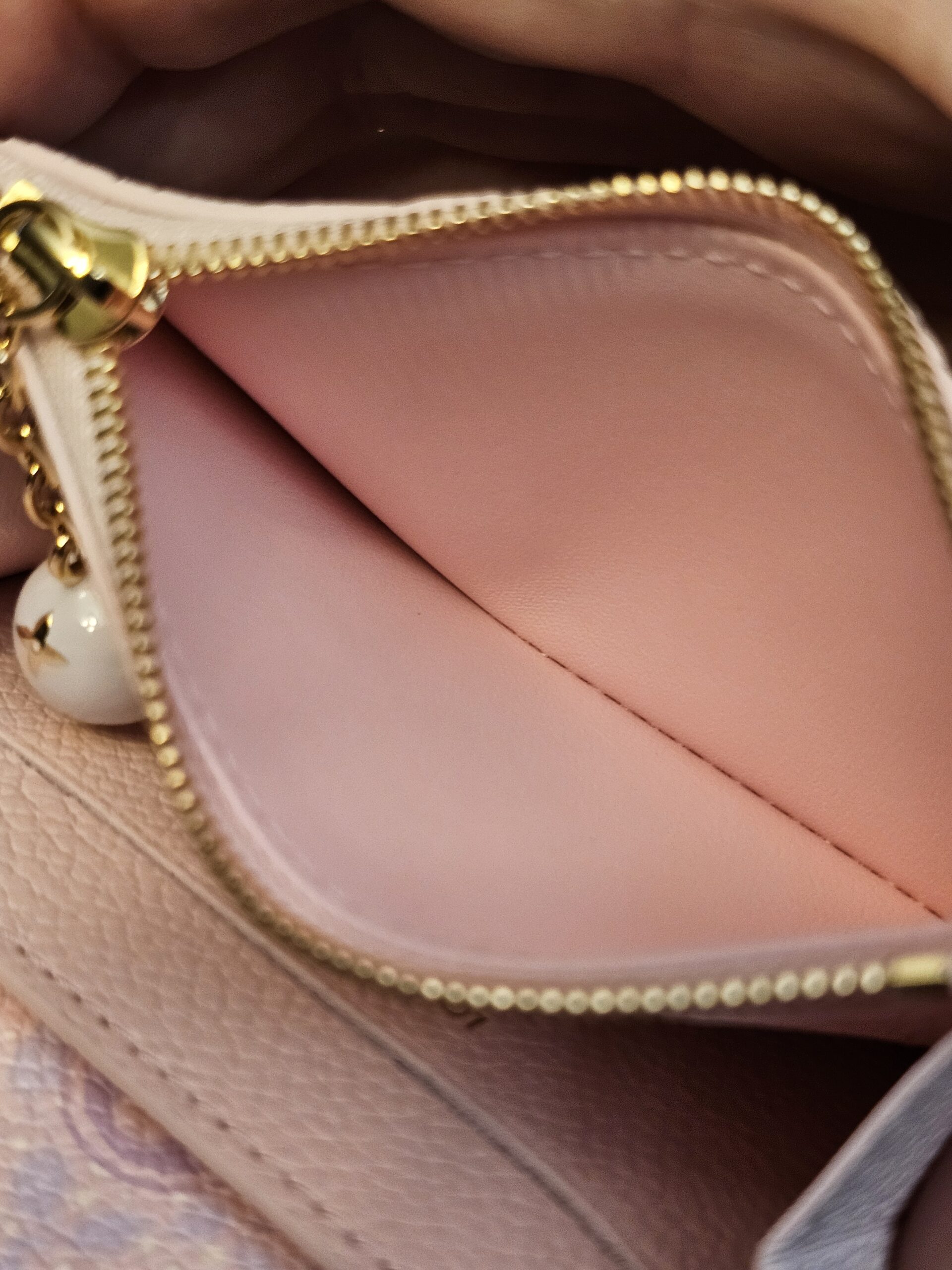 Zipped coin compartment of the Rosalie coin purse held open