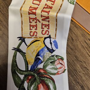 Close view of the lettering with a bird and tulips printed on the silk