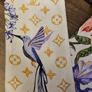 Hummingbird and iris printed over the gold Monogram on the silk bandeau