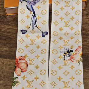 Full length of the silk bandeau folded to show both printed ends