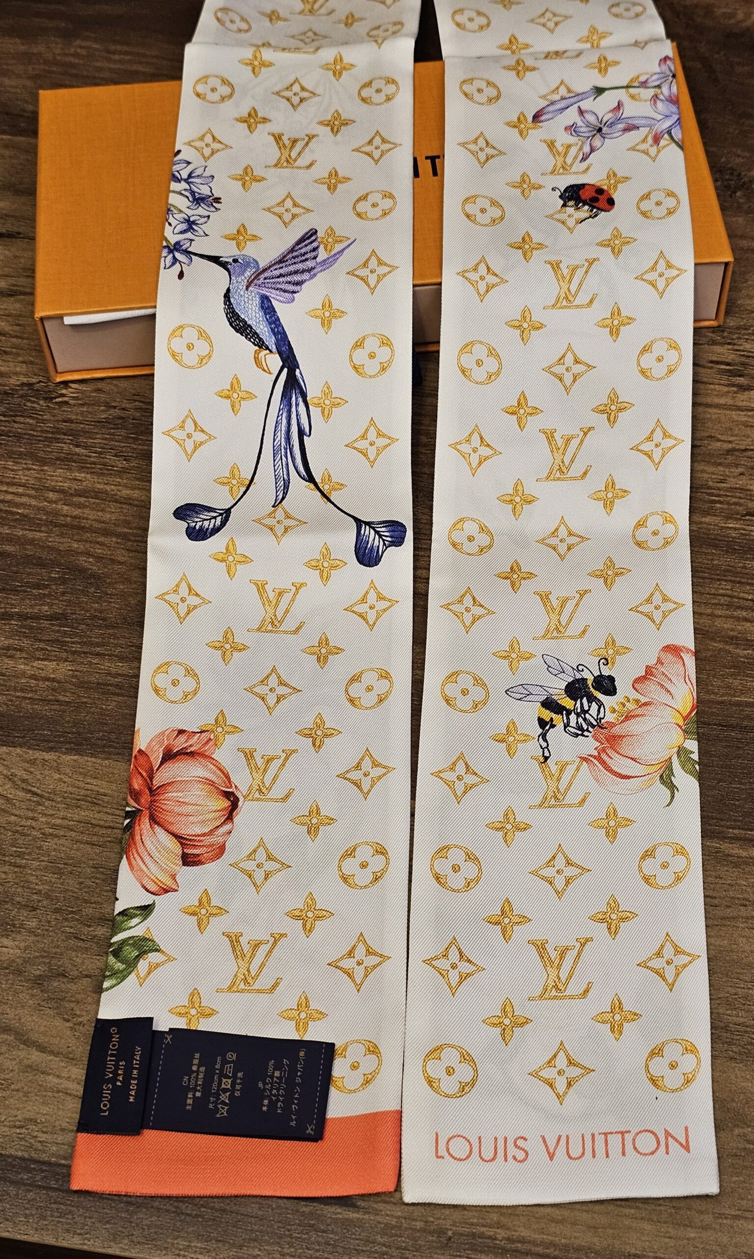 Full length of the silk bandeau folded to show both printed ends