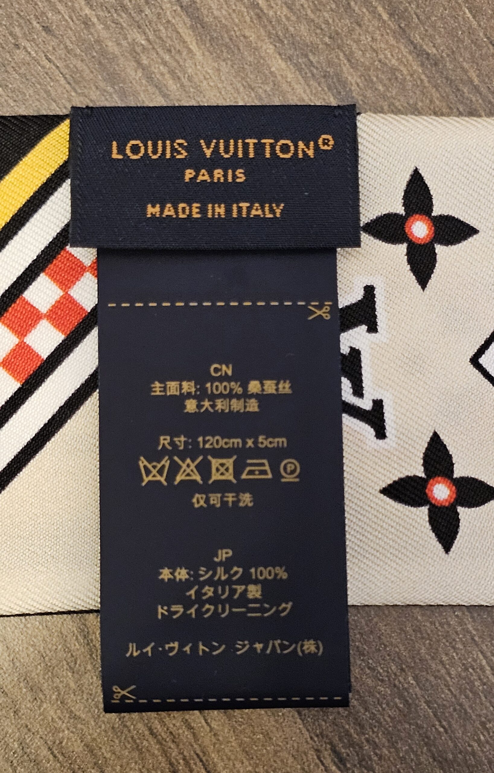 Care label on the bandeau reading Louis Vuitton Paris made in Italy, 100 percent silk