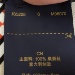 Reverse of the care label showing style code M98070 and production code IS5205