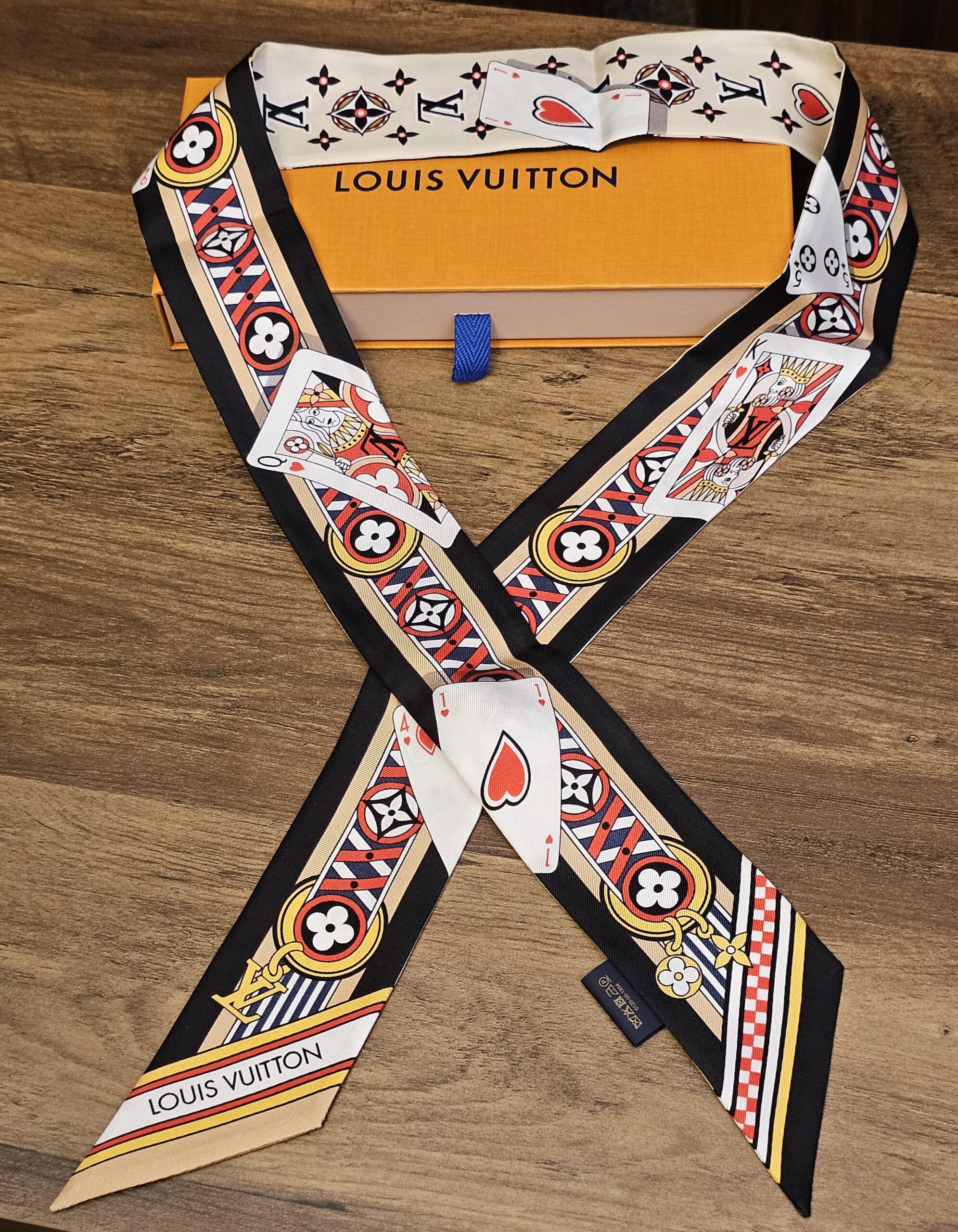 Silk bandeau crossed over to show both printed ends