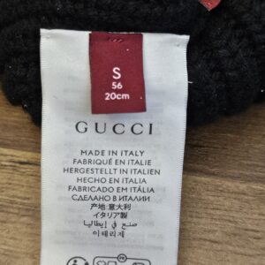 Care tag inside the beanie showing size S, 56 cm, and Made in Italy