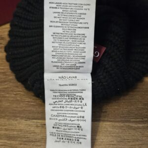 Care instruction label inside the Gucci knit beanie