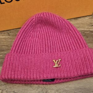Louis Vuitton Spark Cashmere Beanie Fuchsia Pink shown front on with the gold tone LV logo on the folded cuff