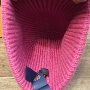 Inside of the Louis Vuitton cashmere beanie showing the ribbed crown and navy ribbon