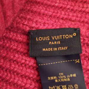 Louis Vuitton Paris Made in Italy label sewn into the fuchsia cashmere knit