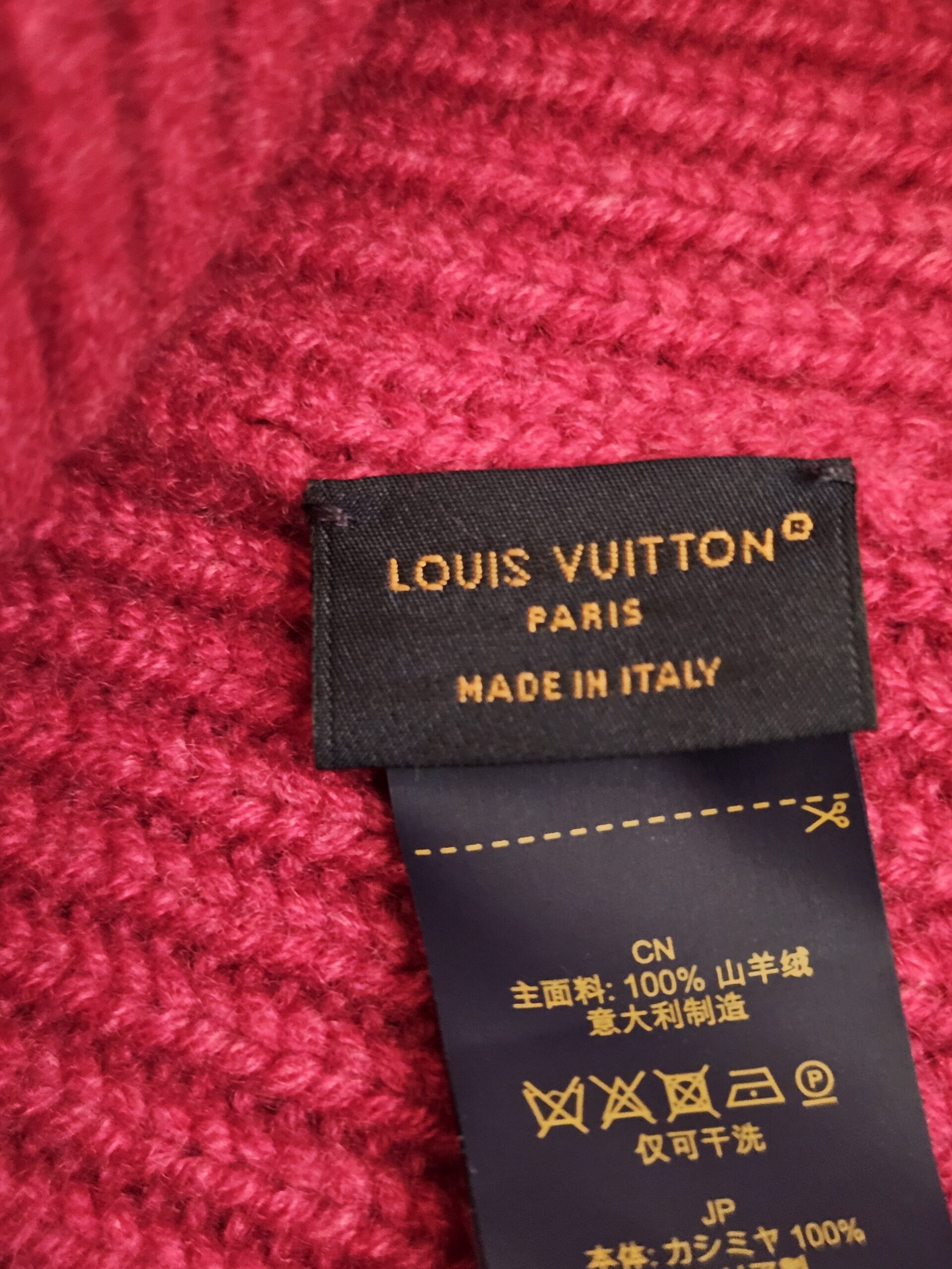 Louis Vuitton Paris Made in Italy label sewn into the fuchsia cashmere knit