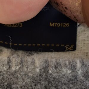 Scarf tag showing the style codes AB3273 and M79126