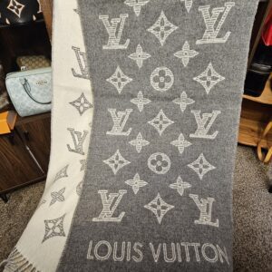 Monogram Shadow scarf draped to show the gray side with the ivory monogram motif