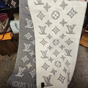 Monogram Shadow scarf draped to show the ivory side with the gray monogram motif