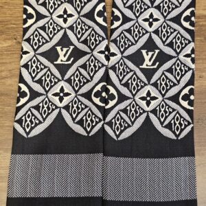 Since 1854 bandeau folded to show the pattern and the striped ends