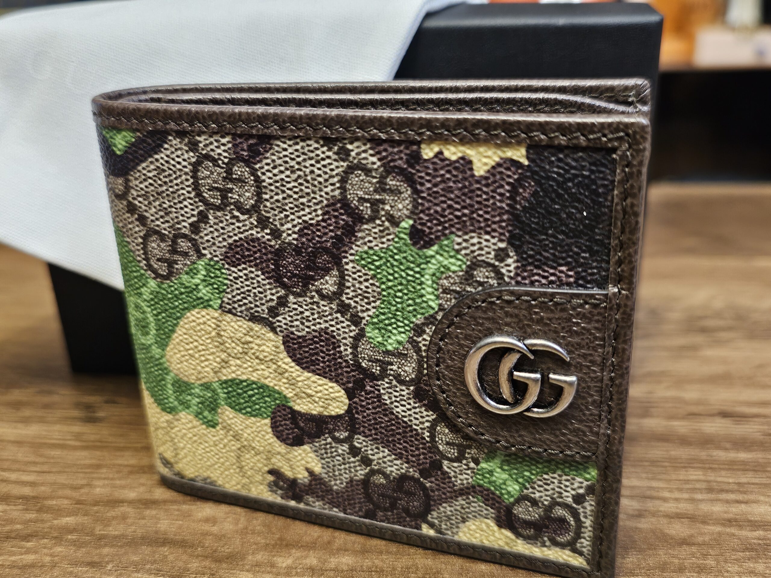 Gucci GG Supreme Camouflage Bifold Wallet Green Brown closed, showing the camo canvas and Double G hardware