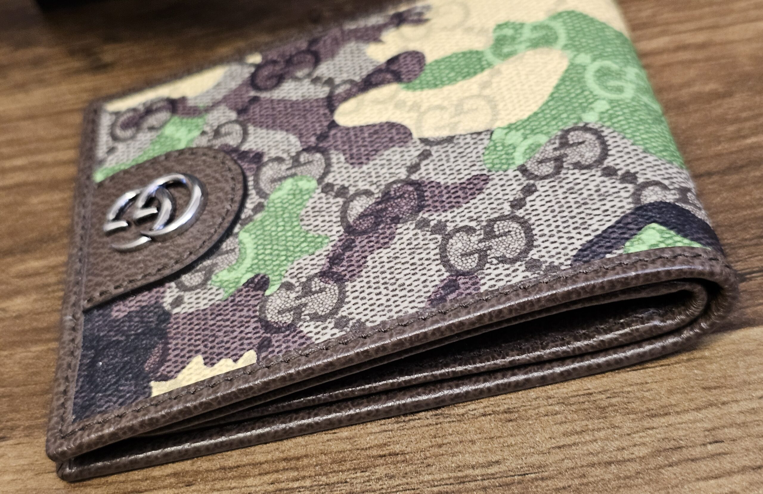 Reverse of the Gucci camouflage bifold wallet with brown leather trim