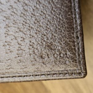 Brown leather interior of the wallet with the Gucci stamp