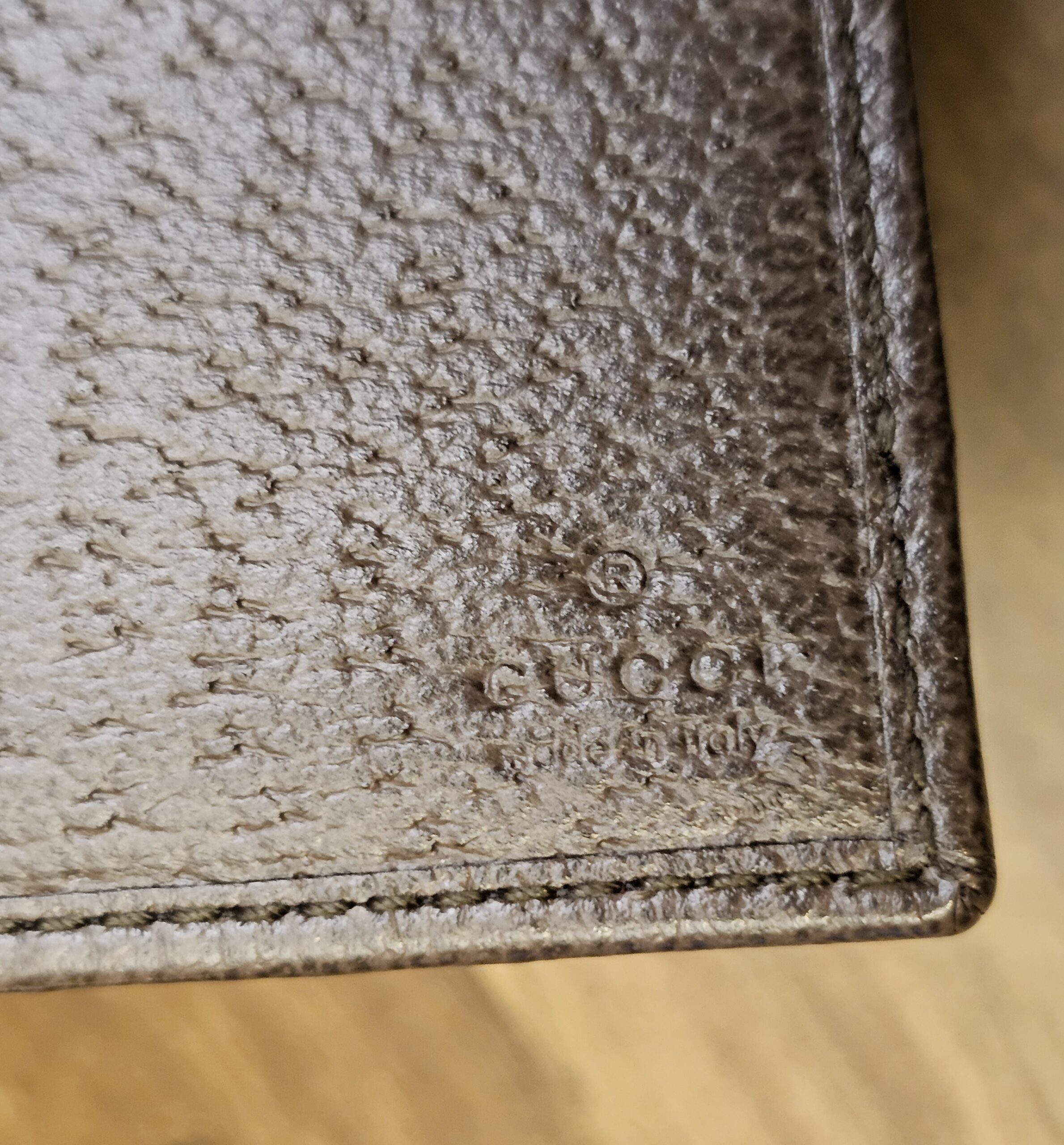 Brown leather interior of the wallet with the Gucci stamp